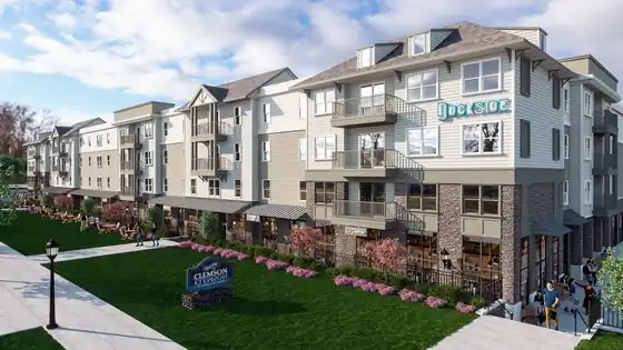 Multi-storey residential building with balconies, a Dockside sign and a landscaped courtyard